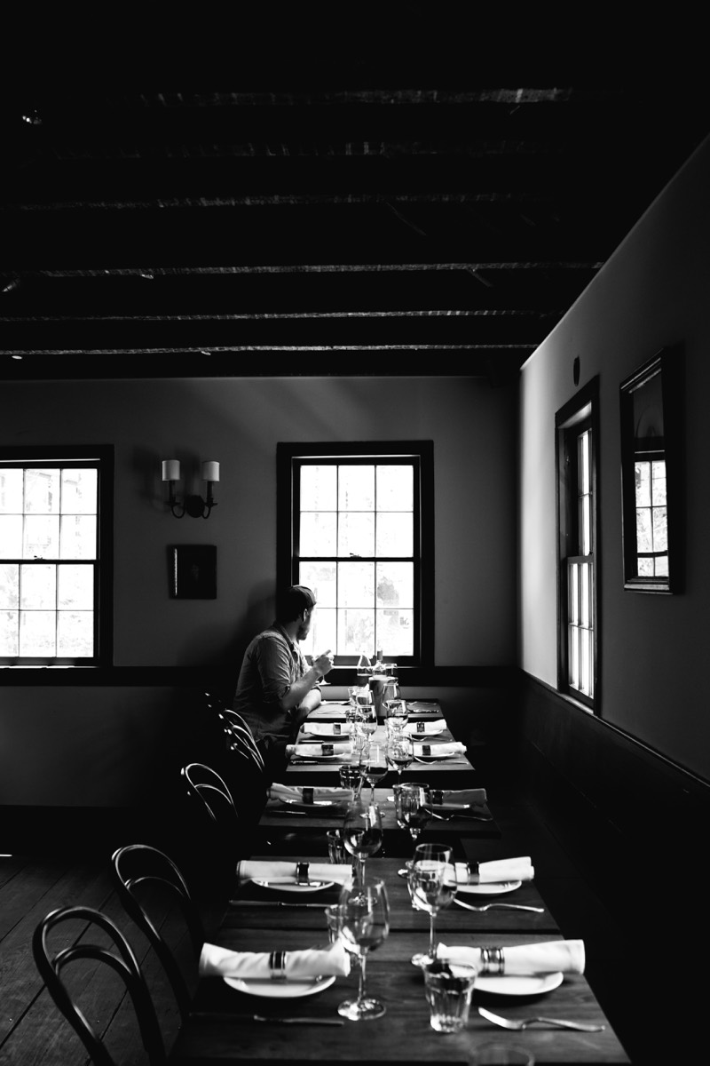 A warmly lit dining room at Chez Nous