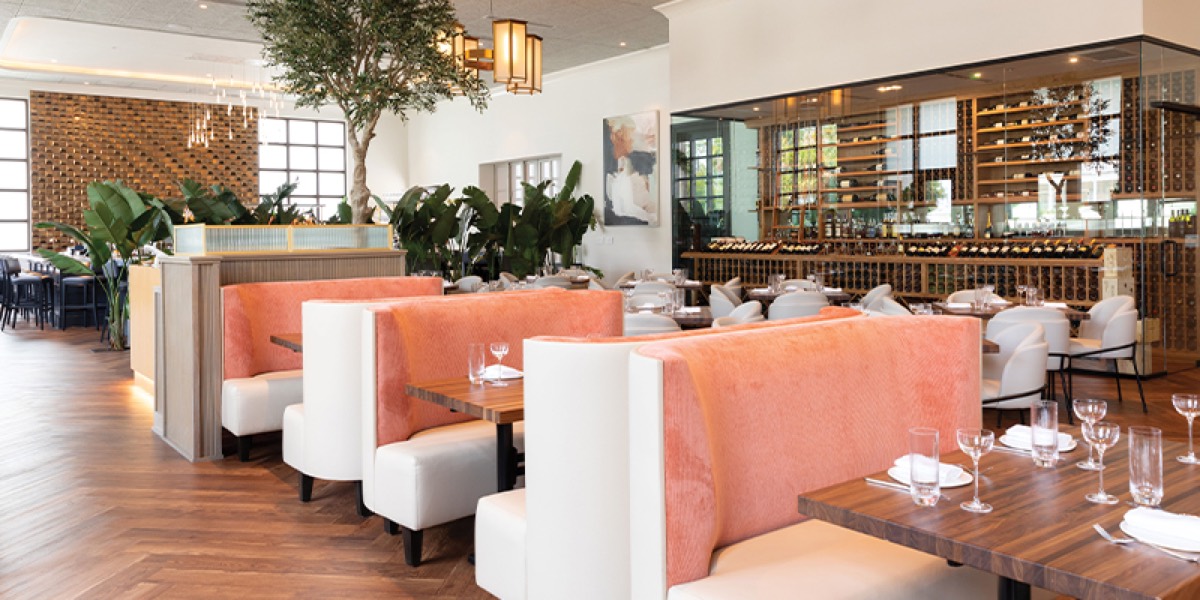 The dining room at Marbled & Fin with blush banquettes